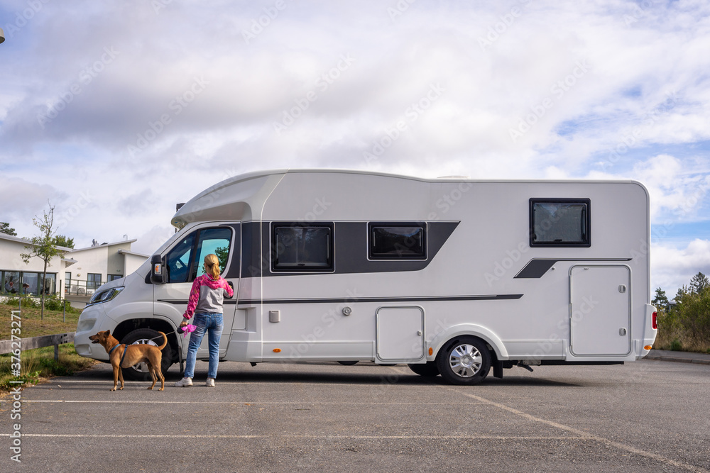Caravan travel trailer RV motorhome camper. Car vehicle journey. Tourism Summer vacation holidays activity trip to Europe.