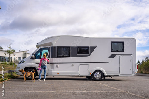 Caravan travel trailer RV motorhome camper. Car vehicle journey. Tourism Summer vacation holidays activity trip to Europe.