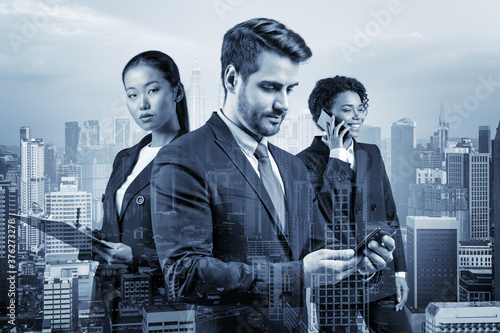 Canvas Print Group of three business colleagues in suits working on project together to gain new career opportunities