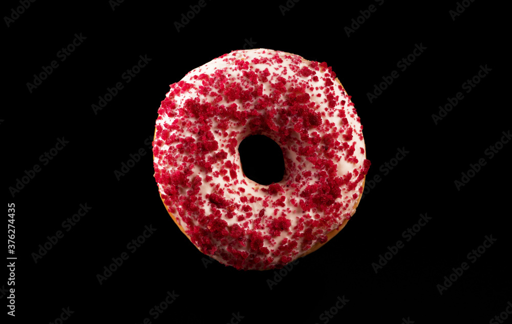 Flying pink glazed donut with sprinkles. Flying pink glazed donut with sprinkles.