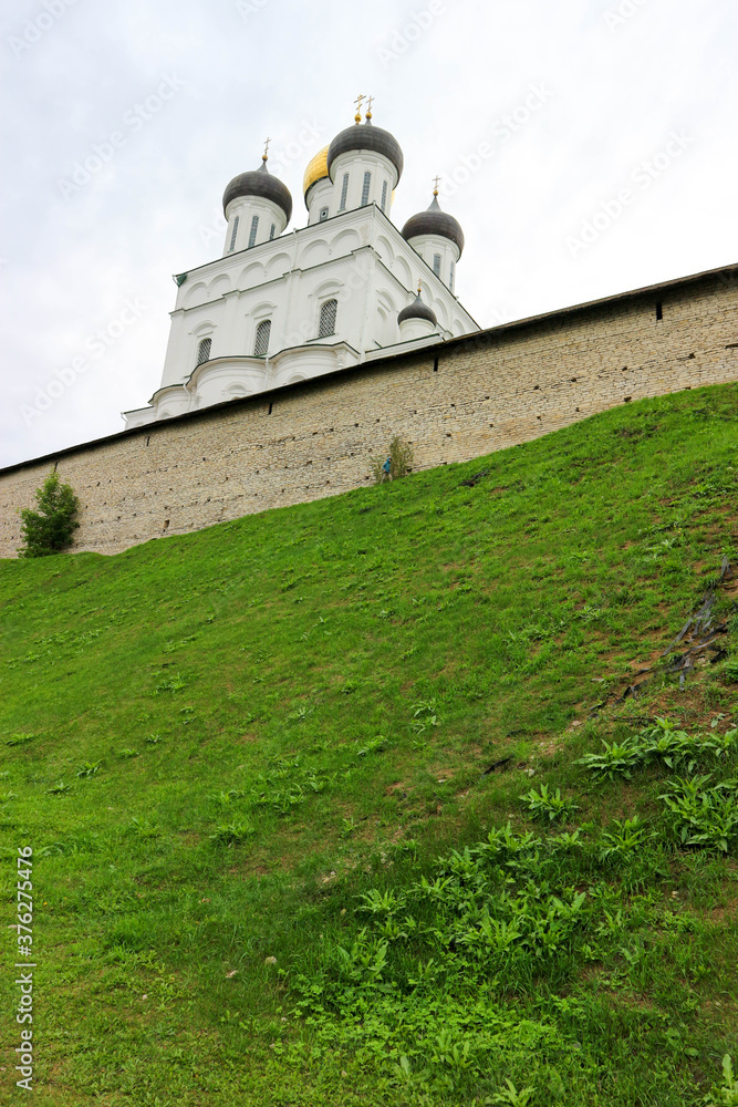 Pskov trinity cathedral inside the kremlin (krom) walls on the green hill