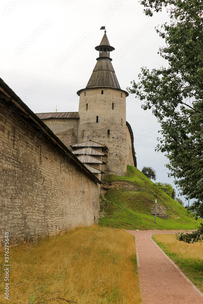 Fototapeta premium The bonfire tower with wooden roof of Pskov kremlin (krom) medieval fortress, famous landmark of Russia