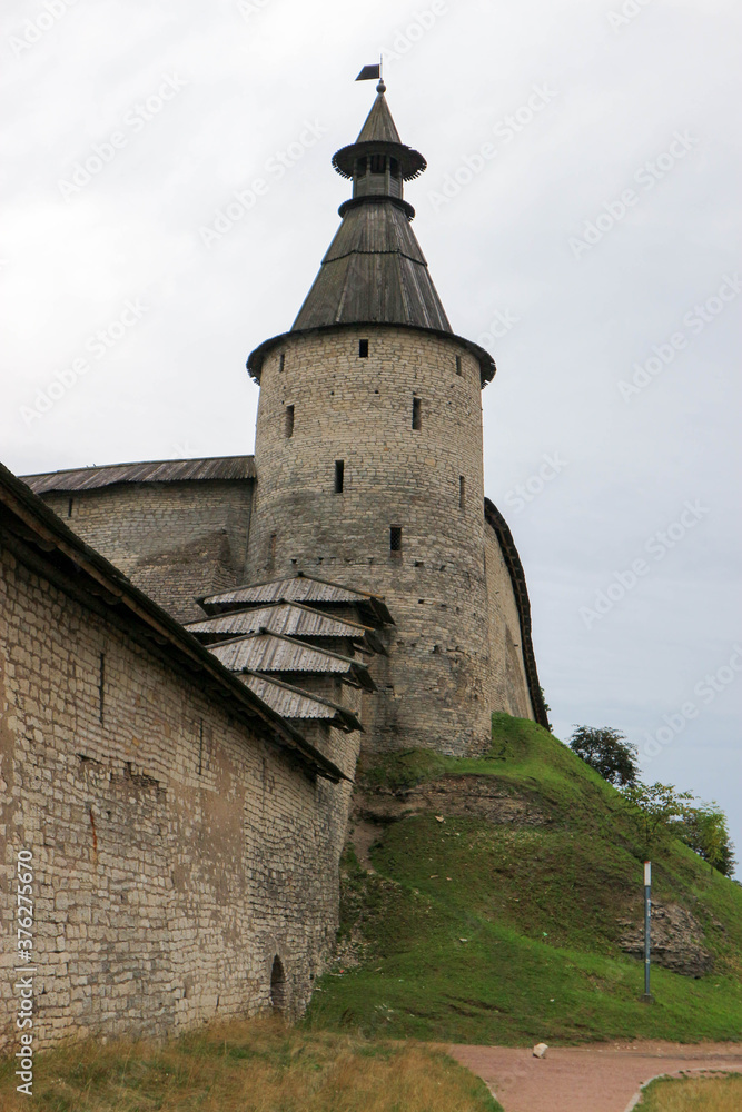 The bonfire tower with wooden roof of Pskov kremlin (krom) medieval fortress, famous landmark of Russia