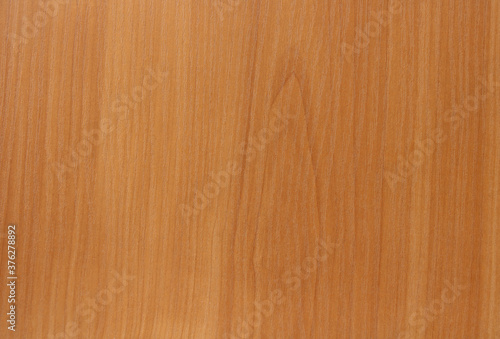 Natural wooden backghound. Abstract Background of a cherry wood or wooden table surface with fine texture. Natural wooden backghound.