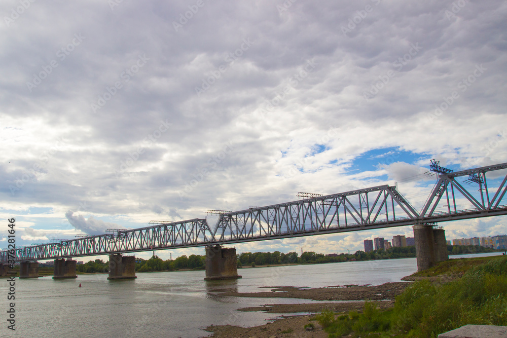 Obraz premium Railway Bridge in Novosibirsk. Railway bridge over the Great Siberian river Ob.