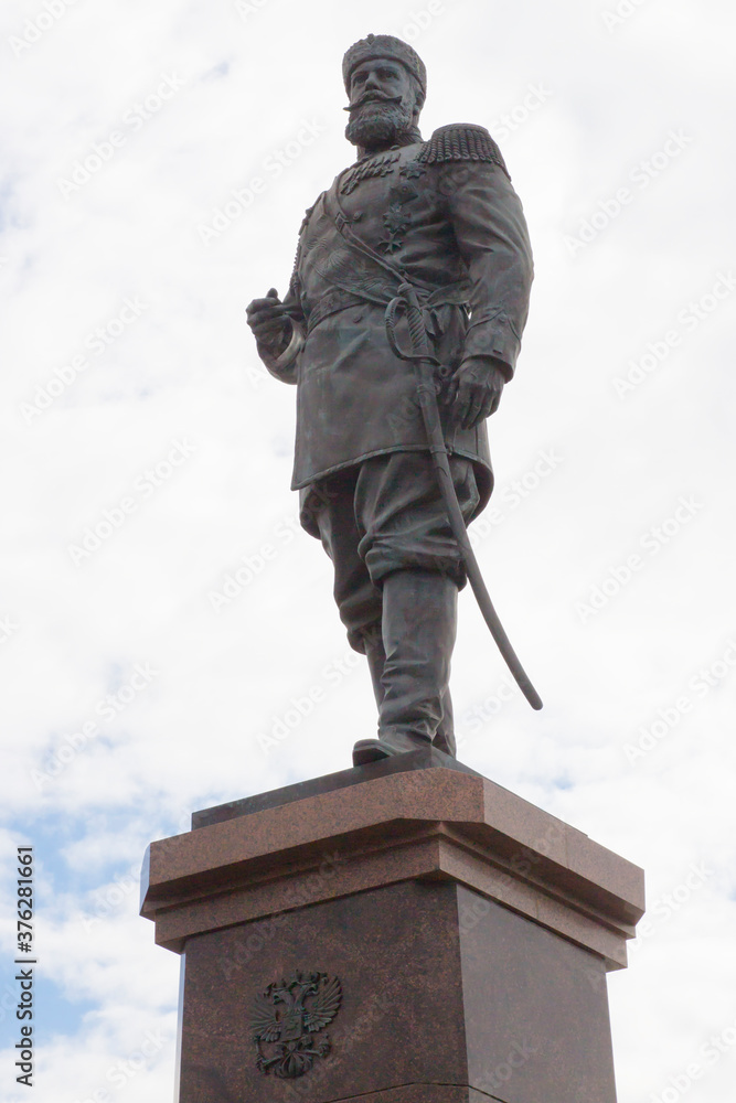 Fototapeta premium The monument to Russian Emperor Alexander III is located on the Ob river embankment in Novosibirsk, Russia