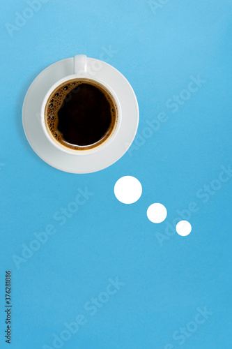 Creative food drink concept photo of coffee cup mug in shape of comics cloud thinking on blue background.
