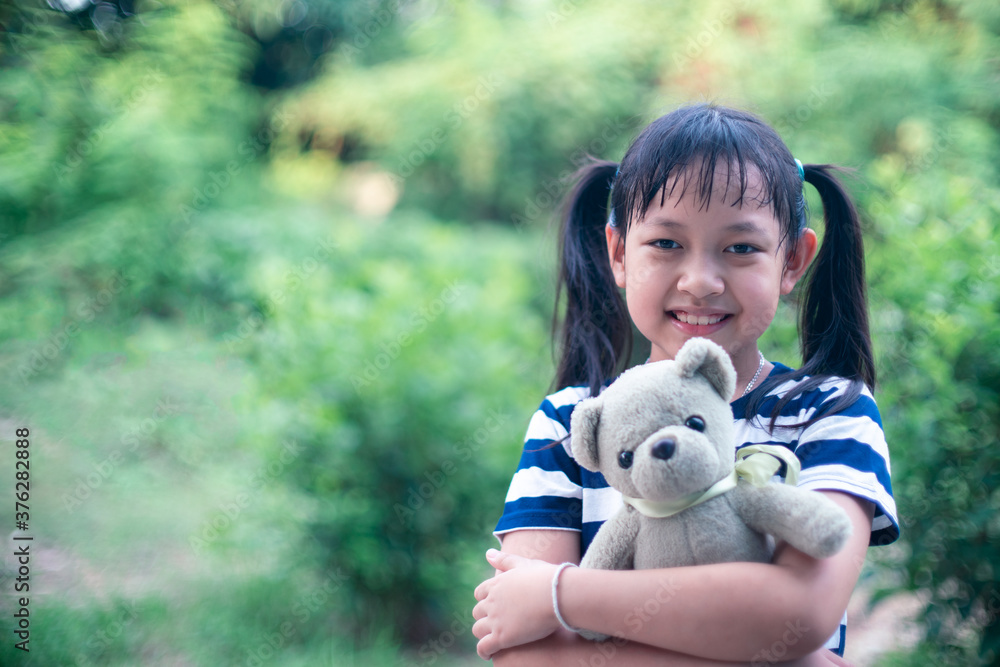 Smile little child girl hugging teddy bear with love Smile little child girl hugging teddy bear with love