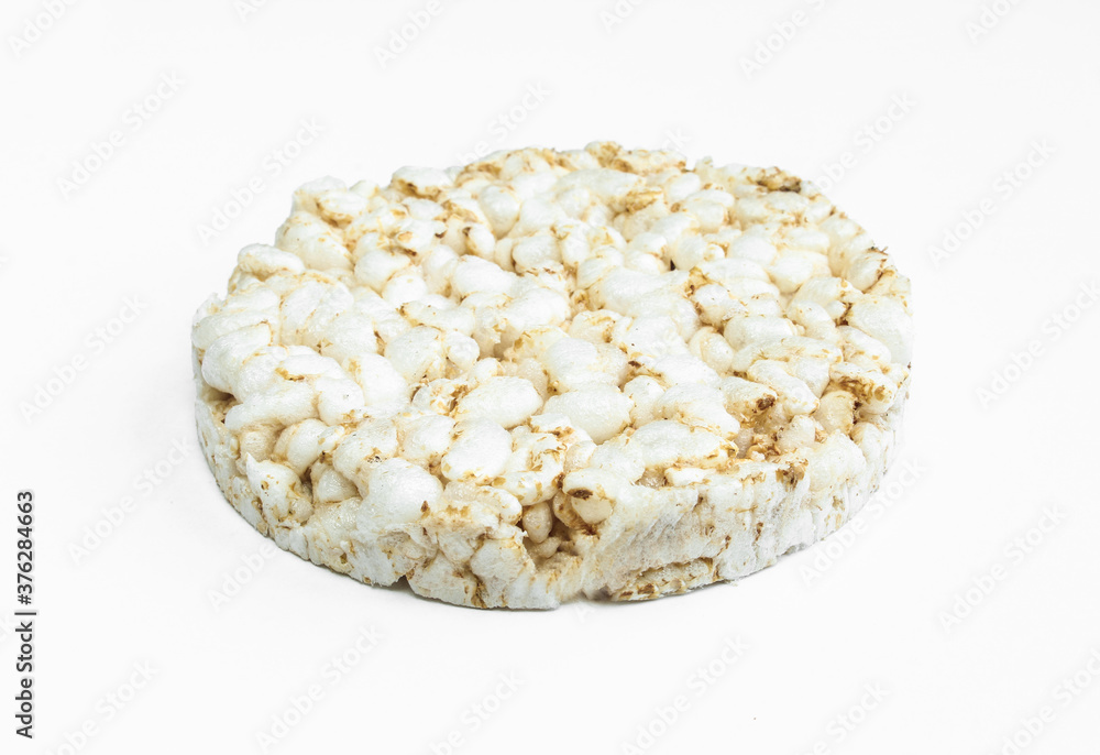 Rice cake slice isolated on white background. Tasty dry dietary food Rice cake slice isolated on white background. Tasty dry dietary food