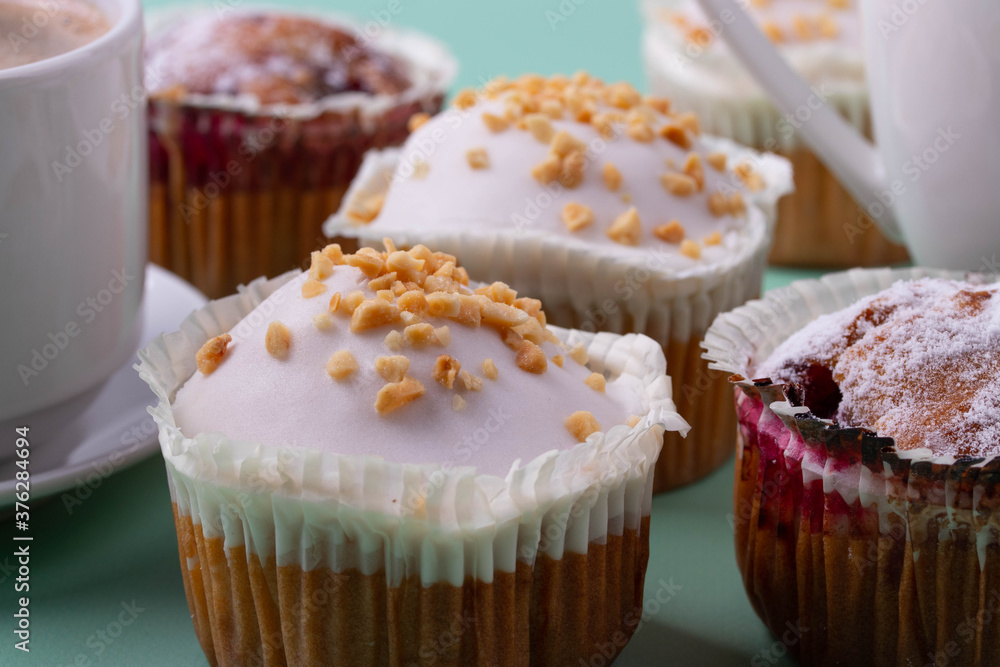 yummy sweet tasty muffin cakes on simple mono color background yummy sweet tasty muffin cakes on simple mono color background