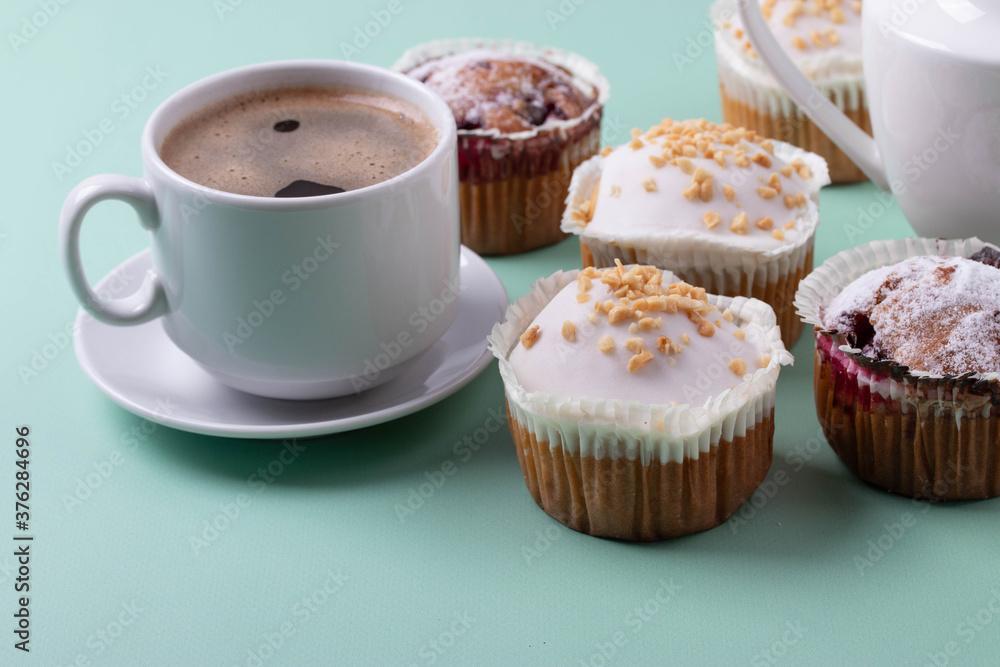 yummy sweet tasty muffin cakes on simple mono color background yummy sweet tasty muffin cakes on simple mono color background