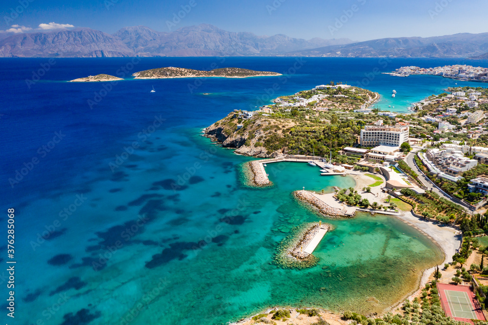 Aerial view of the crystal clear waters of the Cretan sea and Mirabello gulf (Agios Nikolaos, Crete, Greece)