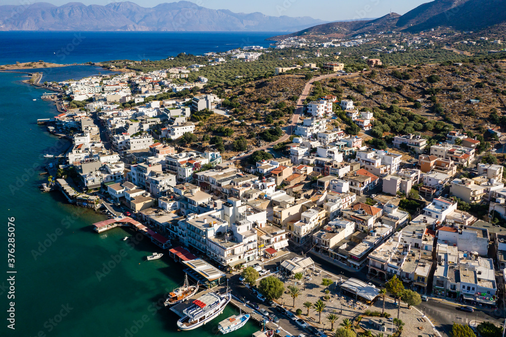ELOUNDA, CRETE, GREECE - 27 AUGUST 2020: Aerial view of the seafront in the popular Greek town of Elounda on the island of Crete