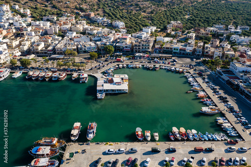 ELOUNDA, CRETE, GREECE - 27 AUGUST 2020: Aerial view of the harbor in the popular Greek tourist town of Elounda on the island of Crete