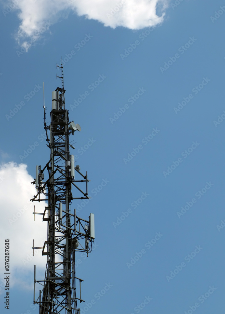 telecommunication mast with mobile phone antennas relay equipment and terrestrial tv arials