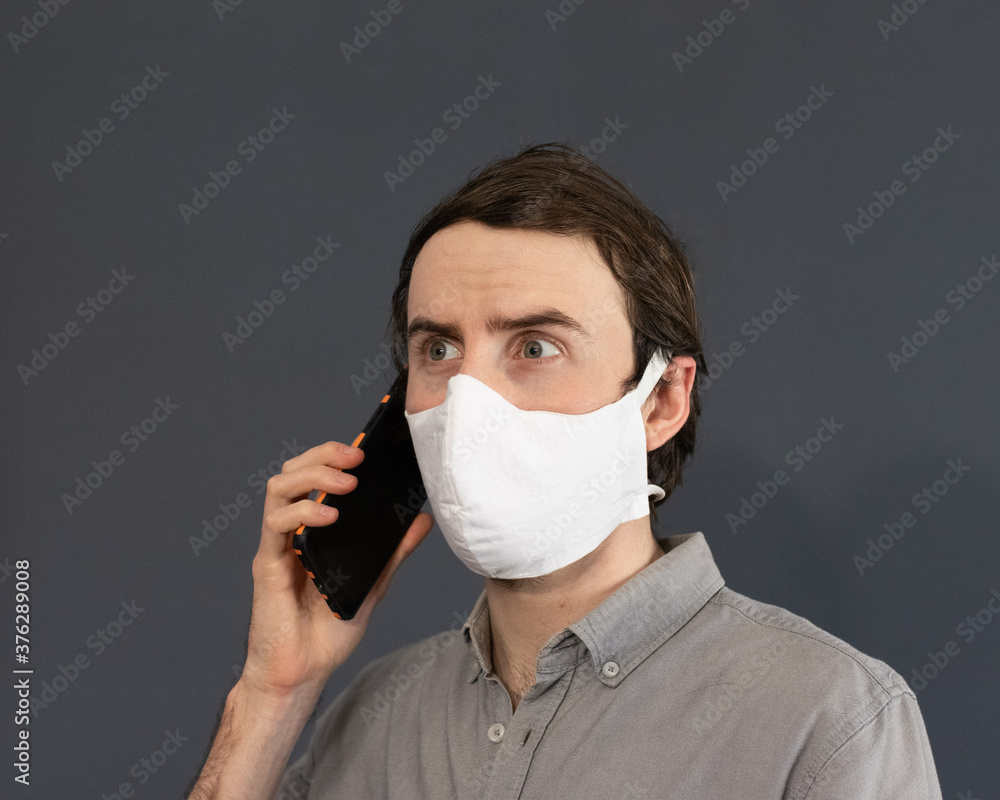 Man with mask on the phone
Man with mask on the phone