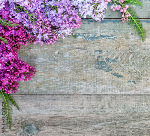 Multicolored lilac old wooden background