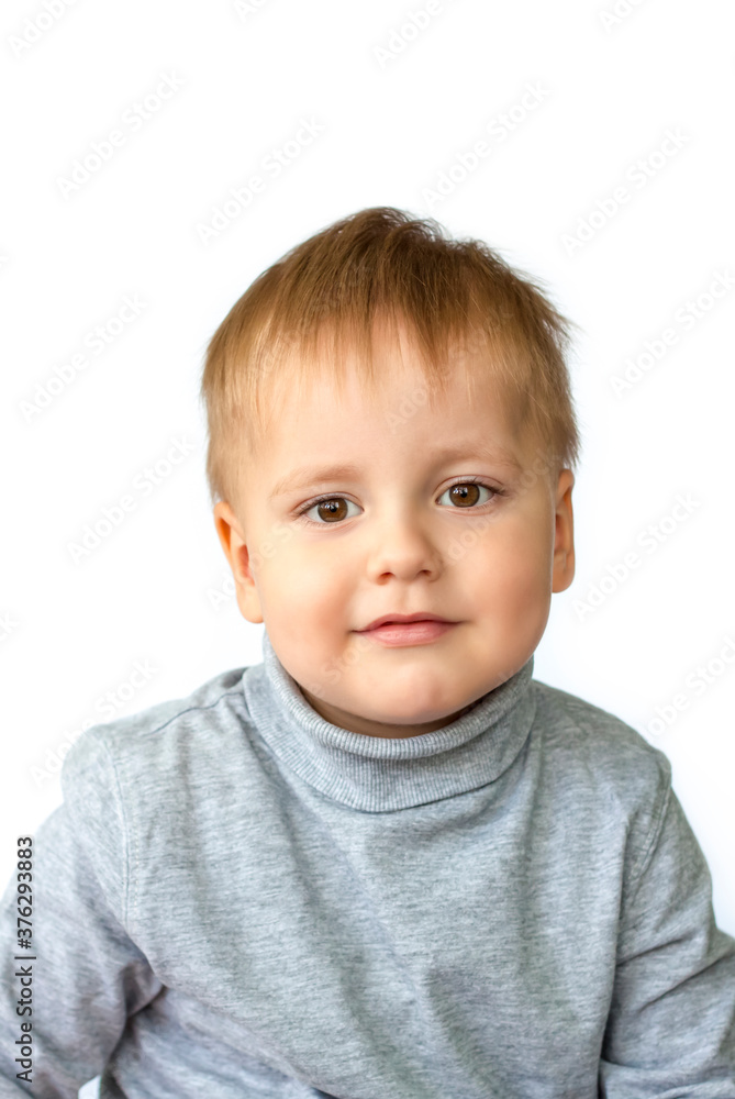 Portrait of an astonished cute little boy. The child is isolated on a white background. Success, bright idea, creative ideas and innovative technological concepts. Concept for an advertising banner. Portrait of an astonished cute little boy. The child is isolated on a white background. Success, bright idea, creative ideas and innovative technological concepts. Concept for an advertising banner.