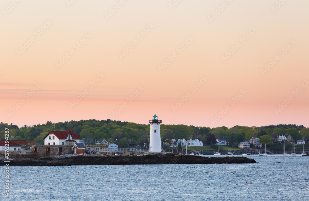 Portsmouth Harbor Lighthouse after sunset. The lighthouse is a historic lighthouse located within Fort Constitution in New Castle, New Hampshire, United States.
