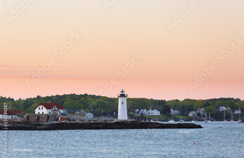 Portsmouth Harbor Lighthouse after sunset. The lighthouse is a historic lighthouse located within Fort Constitution in New Castle, New Hampshire, United States.