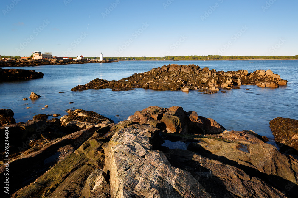 Portsmouth Harbor Lighthouse at Sunset with low tide. Portsmouth Harbor Lighthouse is a historic lighthouse located within Fort Constitution in New Castle, New Hampshire, United States.