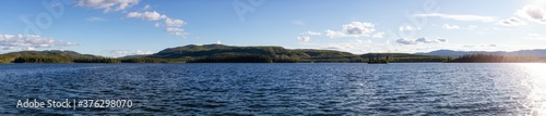 Panoramic View of Twin Lakes during a sunny summer day. Located North of Whitehorse  Yukon  Canada.