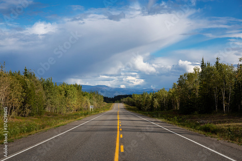 Scenic Road View of Klondike Hwy during a sunny and cloudy day. Taken near Whitehorse, Yukon, Canada. © edb3_16
