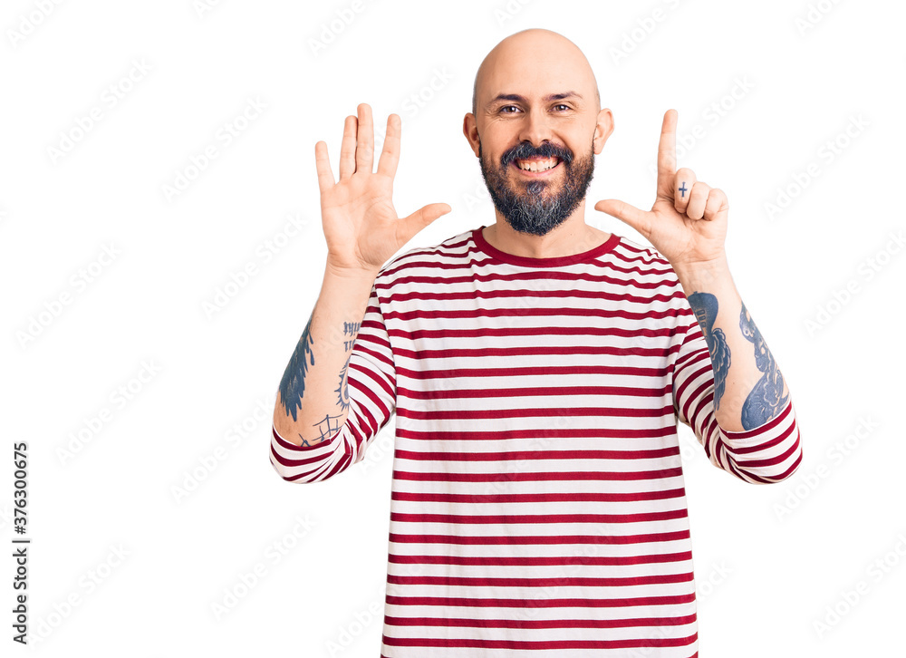 Young handsome man wearing casual clothes showing and pointing up with fingers number seven while smiling confident and happy. Young handsome man wearing casual clothes showing and pointing up with fingers number seven while smiling confident and happy.