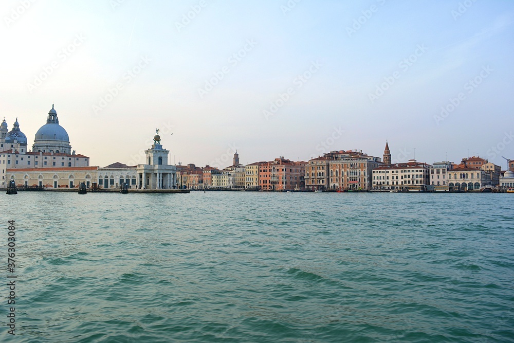 italy venice lagoon cityscape from boat at sunset