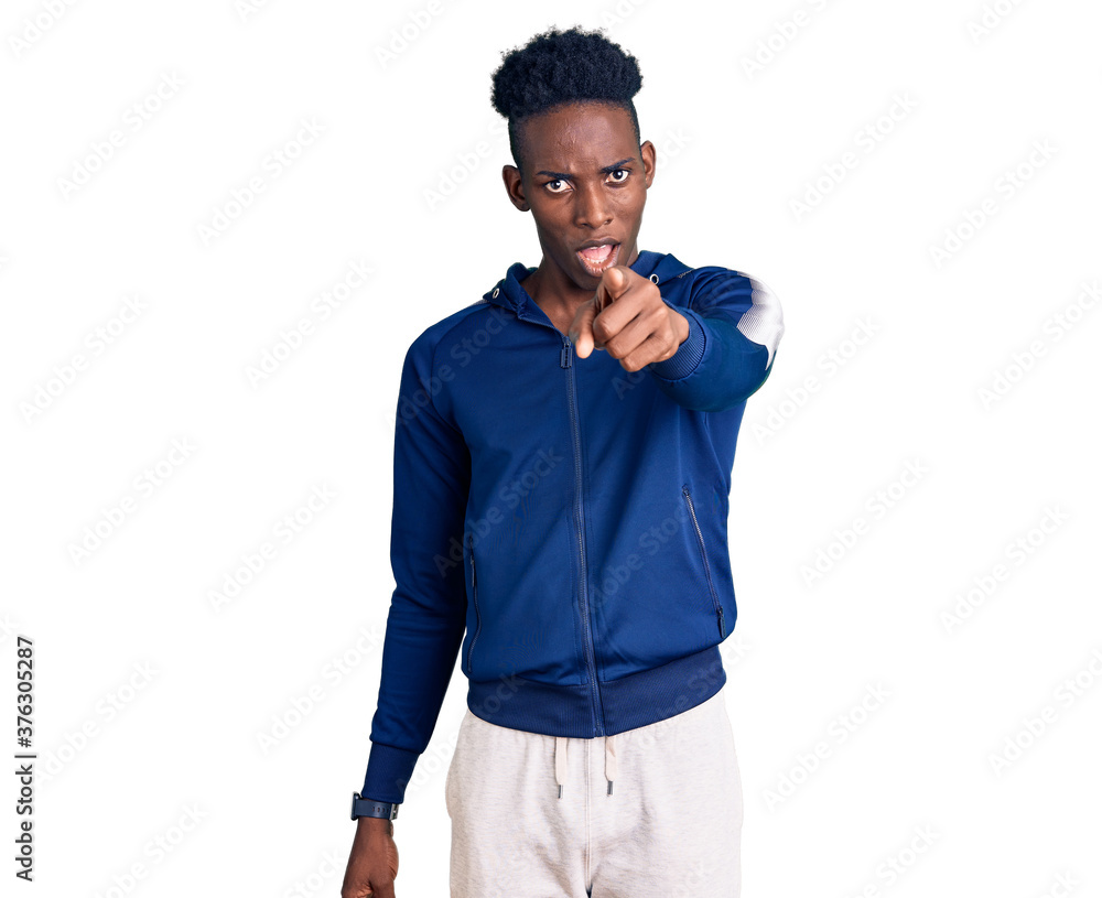 Young african american man wearing sportswear pointing displeased and frustrated to the camera, angry and furious with you Young african american man wearing sportswear pointing displeased and frustrated to the camera, angry and furious with you