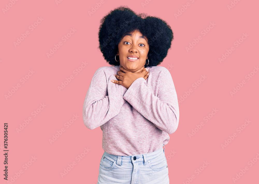 Young african american girl wearing casual clothes shouting and suffocate because painful strangle. health problem. asphyxiate and suicide concept. Young african american girl wearing casual clothes shouting and suffocate because painful strangle. health problem. asphyxiate and suicide concept.