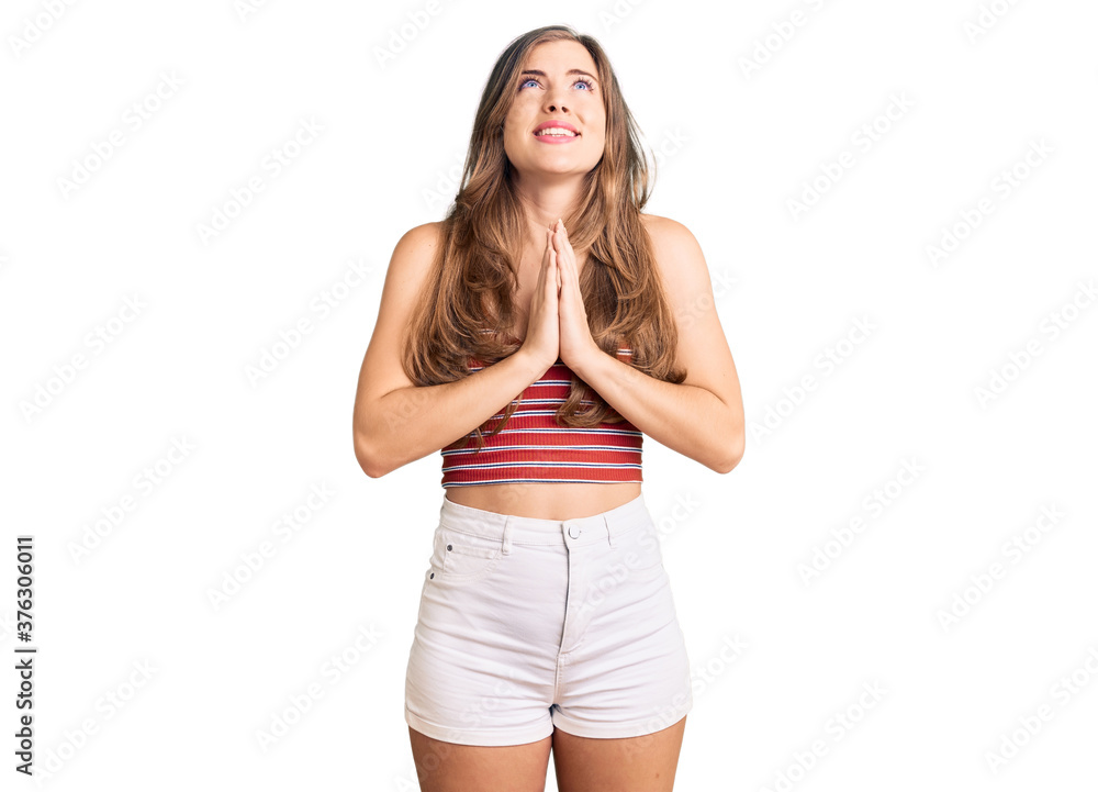 Beautiful caucasian young woman wearing casual clothes begging and praying with hands together with hope expression on face very emotional and worried. begging. Beautiful caucasian young woman wearing casual clothes begging and praying with hands together with hope expression on face very emotional and worried. begging.