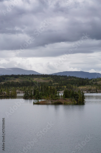 Beautiful View of Lewes Lake during a cloudy summer day. Located near Whitehorse, Carcross, Yukon, Canada.