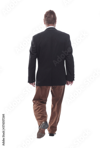 smiling business man walking towards you . isolated on a white © ASDF