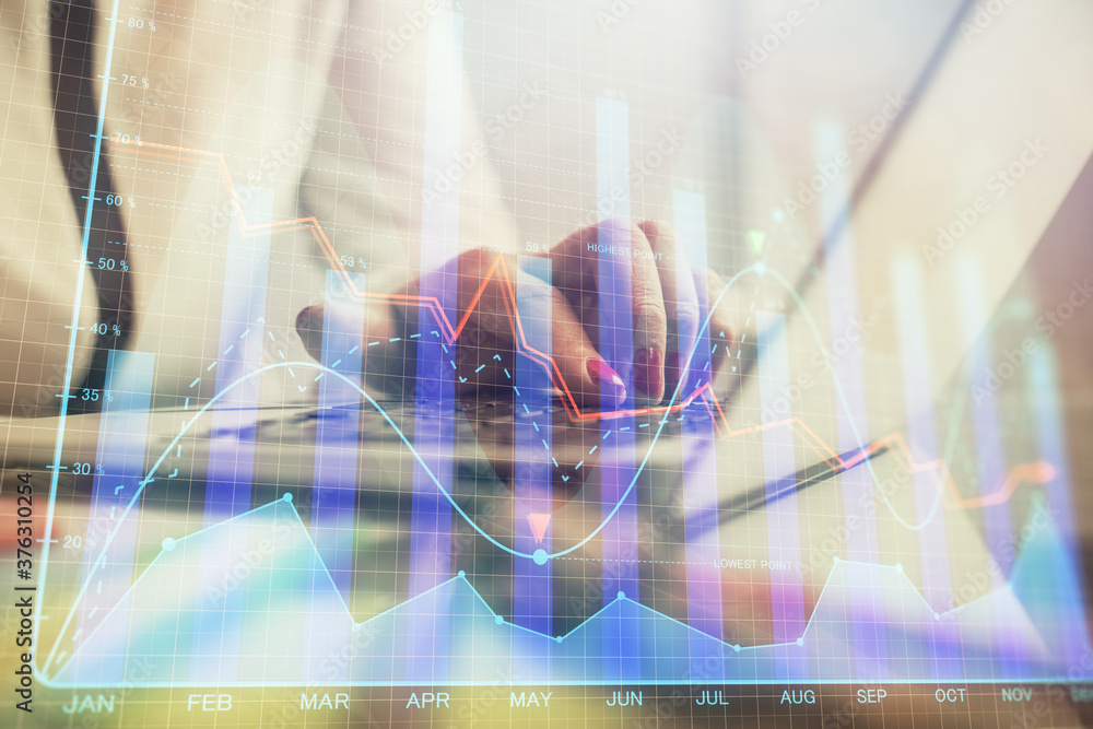 Double exposure of businesswoman hands typing on computer and financial graph hologram drawing. Stock market analysis concept. Double exposure of businesswoman hands typing on computer and financial graph hologram drawing. Stock market analysis concept.