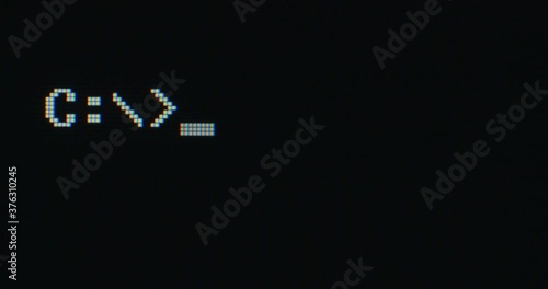 Blinking terminal prompt on a computer screen. Extreme closeup. photo