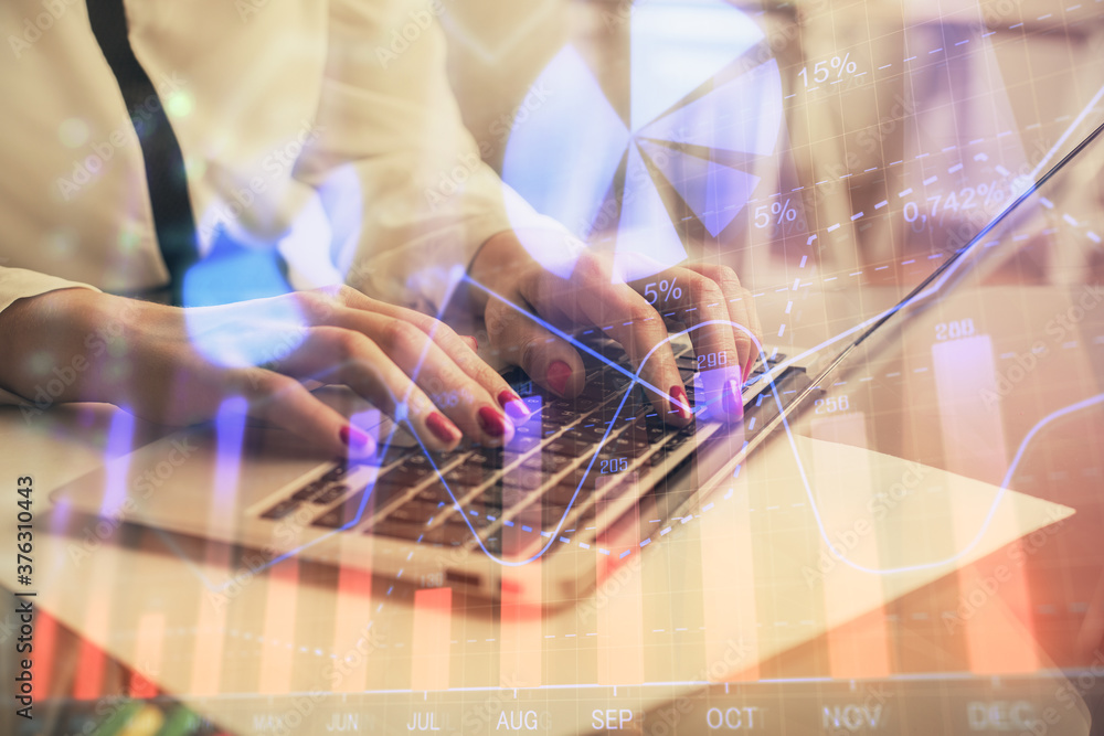 Multi exposure of woman hands typing on computer and financial graph hologram drawing. Stock market analysis concept. Multi exposure of woman hands typing on computer and financial graph hologram drawing. Stock market analysis concept.