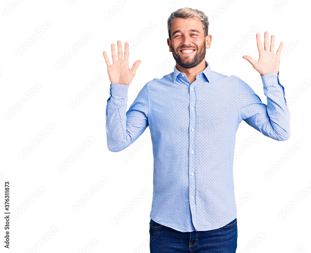 Young handsome blond man wearing elegant shirt showing and pointing up with fingers number ten while smiling confident and happy. Young handsome blond man wearing elegant shirt showing and pointing up with fingers number ten while smiling confident and happy.