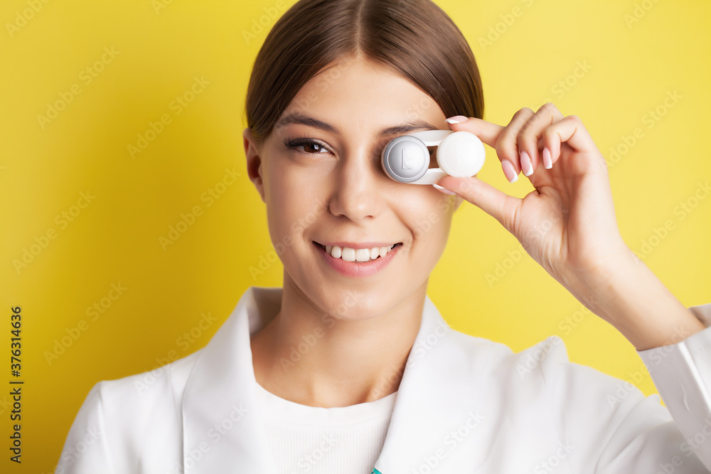 Close up of woman holding container with contact lenses Close up of woman holding container with contact lenses