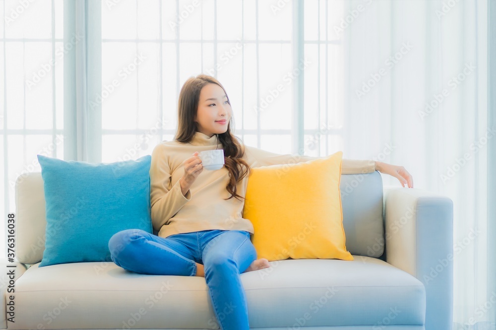 Portrait beautiful young asian woman with coffee cup on sofa decoration Portrait beautiful young asian woman with coffee cup on sofa decoration