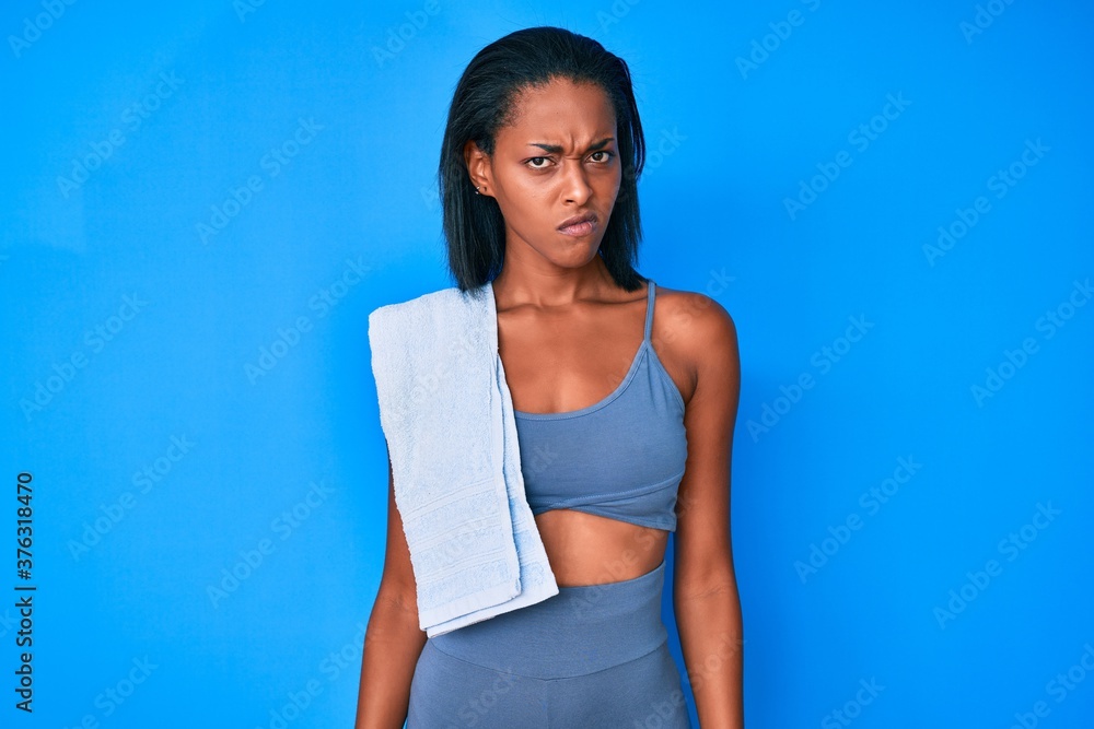 Young african american woman wearing sportswear skeptic and nervous, frowning upset because of problem. negative person. Young african american woman wearing sportswear skeptic and nervous, frowning upset because of problem. negative person.