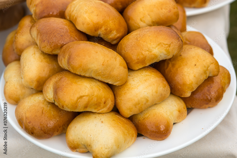 Freshly baked pies are on a plate Freshly baked pies are on a plate