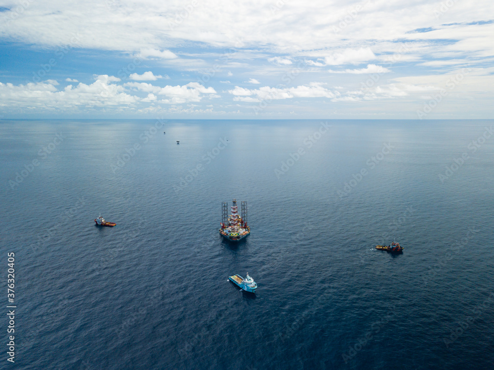 Fototapeta premium Offshore jack up rig and tow vessels during the rig move operation at the offshore location
