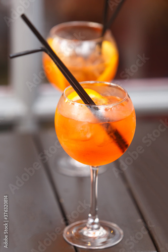 Cocktail glass with a slice of ripe orange