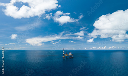 Panoramic aerial view from a drone of an offshore jack up rig at the offshore location during day time © bomboman