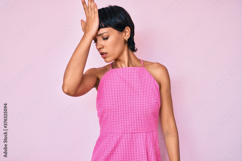 Beautiful brunettte woman wearing casual clothes over pink background surprised with hand on head for mistake, remember error. forgot, bad memory concept. Beautiful brunettte woman wearing casual clothes over pink background surprised with hand on head for mistake, remember error. forgot, bad memory concept.
