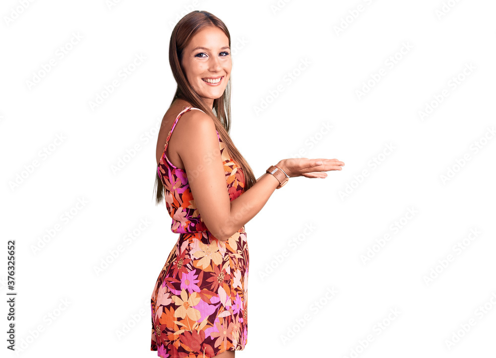 Young beautiful hispanic woman wearing casual clothes pointing aside with hands open palms showing copy space, presenting advertisement smiling excited happy Young beautiful hispanic woman wearing casual clothes pointing aside with hands open palms showing copy space, presenting advertisement smiling excited happy