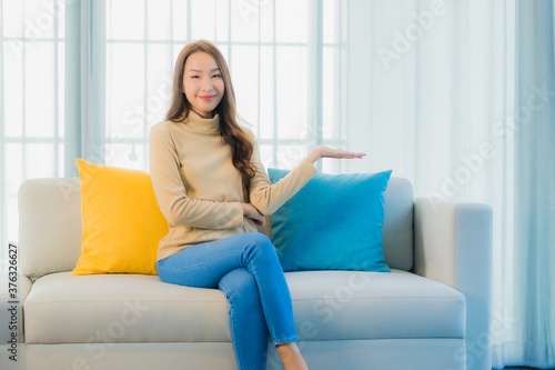 Portrait beautiful young asian woman relax leisure enjoy on sofa