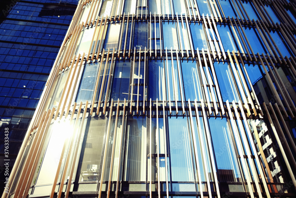 modern business center with big glass wnindows, summer day