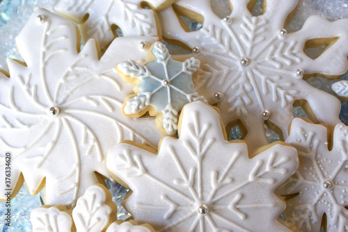 Decorated White and Blue Cut-Out Snowflake Sugar Cookies for Holidays and Winter © mmjohnson